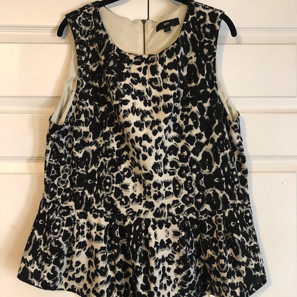 Animal print sleeveless peplum top